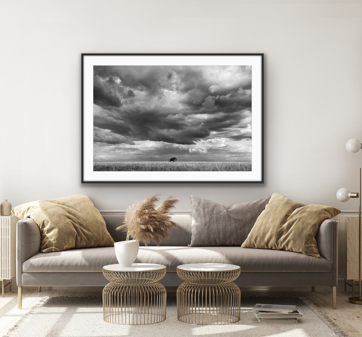 Awarded in BBC wildlife magazine 2026 annual photography competition black and white image of an elephant set against stormy sky on the savanna in Kenya. Room View.